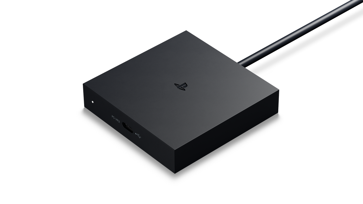 Official PlayStation VR2 PC Adaptor in black, angled view on a white background.