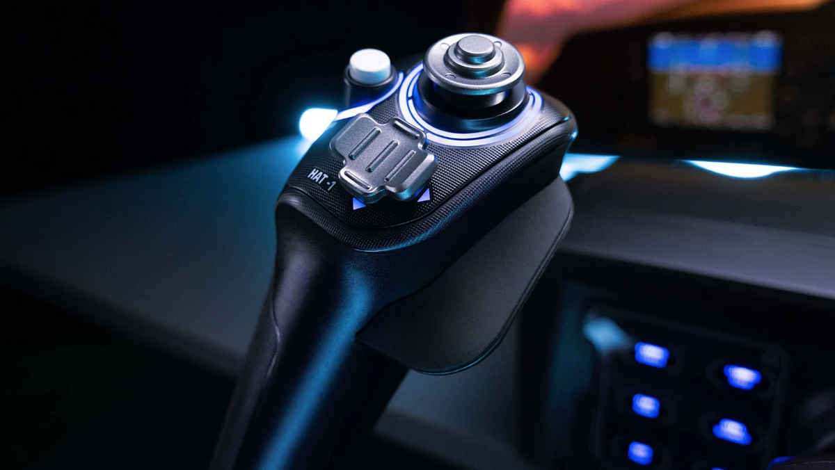 Close-up of the Turtle Beach VelocityOne Flight yoke showing the integrated HAT switch and joystick controls