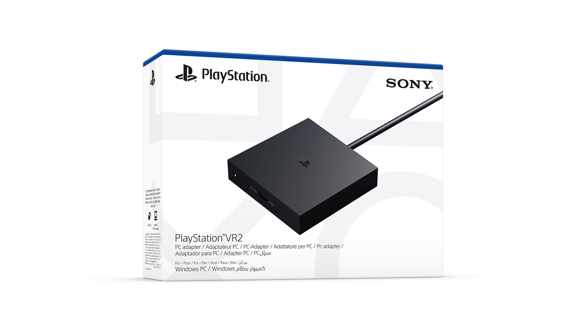 Official PlayStation VR2 PC Adaptor retail packaging beside the adaptor.